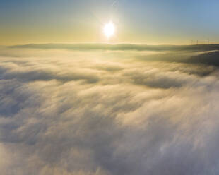 Germany, Baden-Wurttemberg, Drone view of Remstal valley shrouded in thick fog at sunrise - STSF02710