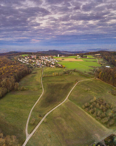 Germany, Baden-Wurttemberg, Drone view of village in Remstal valley at autumn dawn stock photo