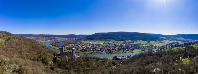 Germany, Bavaria, Stadtprozelten, Helicopter view of riverside town and Henneburg castle in autumn - AMF08853