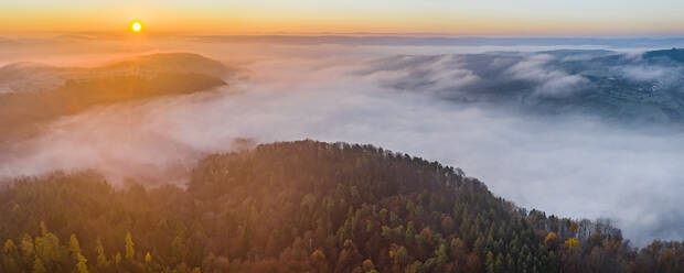 Drone view of Remstal valley shrouded in thick fog at sunrise - STSF02740