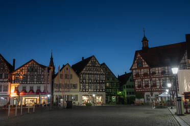 Illuminated town square against clear sky at night, Germany - FDF00298