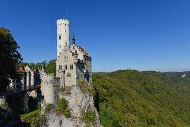 Castle Lichtenstein against clear blue sky on sunny day, Swabian Alb, Germany - FDF00302