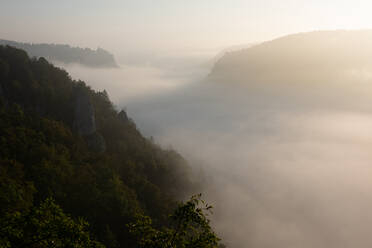 Danube Valley in Swabian Alb mountain during foggy weather at sunset, Germany - FDF00307