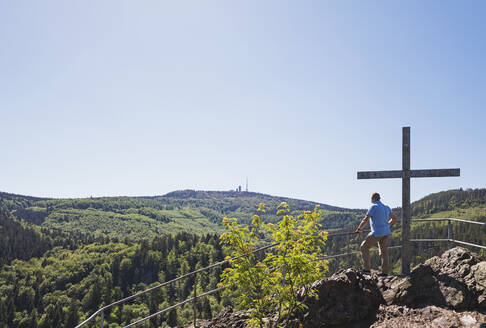 Clear sky over senior hiker admiring Thuringian Forest from observation point - GWF06800