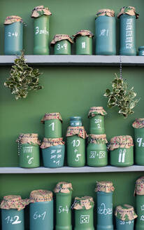 DIY green painted jars representing Advent Calendar - GISF00711