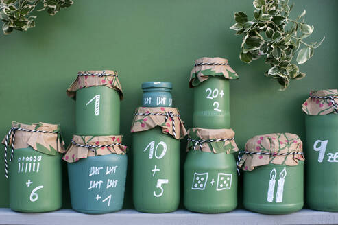 DIY green painted jars representing Advent Calendar - GISF00712