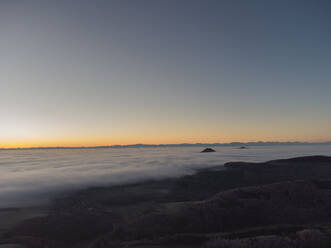 Clear sky over landscape shrouded in thick morning fog - ELF02325