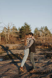 Young couple embracing during autumn hike - SMSF00499