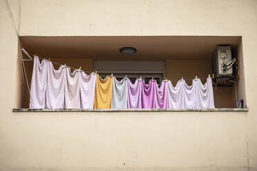 Free Stock Photo of A Row of Clothes Hanging on a Clothes Line