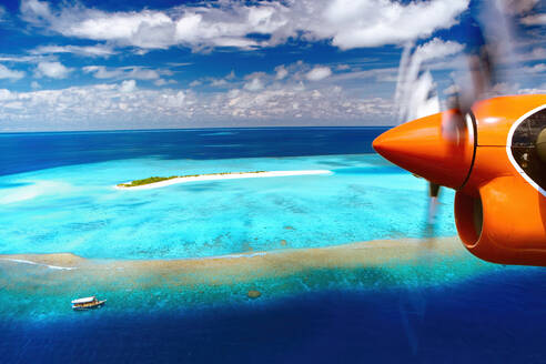 Aerial view of island and seaplane, Male Atoll, The Maldives, Indian Ocean, Asia - RHPLF18588