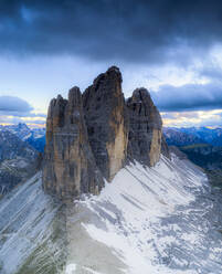 Clouds over the majestic peaks of Tre Cime di Lavaredo, aerial view, Sesto Dolomites Natural Park, South Tyrol, Italy, Europe - RHPLF18708