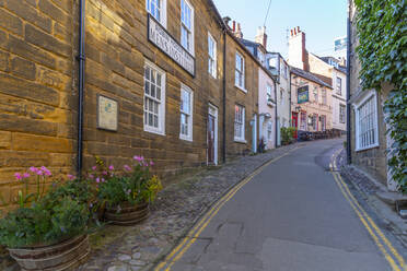 View of pastel coloured houses on King Street in Robin Hood's Bay, North Yorkshire, England, United Kingdom, Europe - RHPLF18883