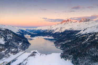 Aerial view of frozen Lake Silvaplana and Piz Corvatsch covered with snow at sunset, Engadine, Graubunden canton, Swiss Alps, Switzerland, Europe - RHPLF18953