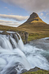 One of Iceland's iconic landscapes, Mount Kirkjufell and Kirkjufellsfoss Falls, near Grundarfjordur, Snaefellsnes peninsula, Iceland, Polar Regions - RHPLF19017