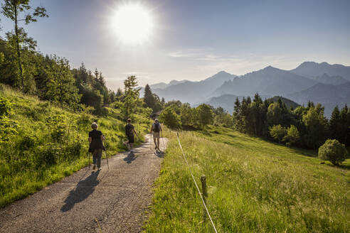 Hikers hiking on mountain at Lake Idro, Lombardy, Italy - MAMF01488