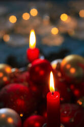 Red burning advent candles and Christmas baubles - JTF01758