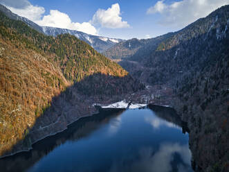 Aerial view of Lake Ritsa surrounded by forested mountains in autumn - KNTF06056