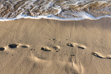 Footprints in beach sand - EGBF00547