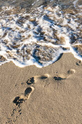 Footprints in beach sand - EGBF00548