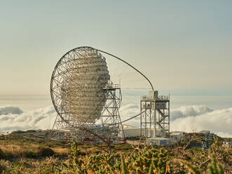 Amazing view of modern telescopes on dark mountaintop against cloudy sky at astronomical observatory on island of La Palma in Spain - ADSF19680