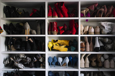 Variation of footwear in rack at home - JCMF01750