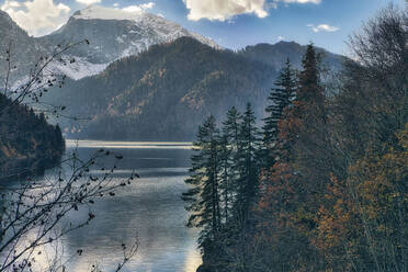 Lake Ritsa surrounded by forested mountains in autumn, Abkhazia, Georgia - KNTF06113