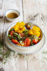 Bowl of vegetarian salad with edible flowers - EVGF03866