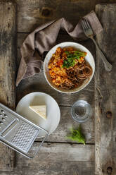 Bowl of vegetarian spaghetti Bolognese with carrots and buckwheat - EVGF03873