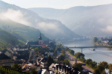 Zell, Mosel River Valley with morning mist clearing, Rhineland-Palatinate, Germany. - MINF15484