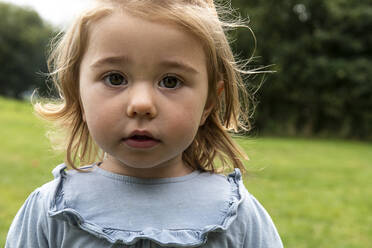 Portrait of little girl in a field - CUF56661