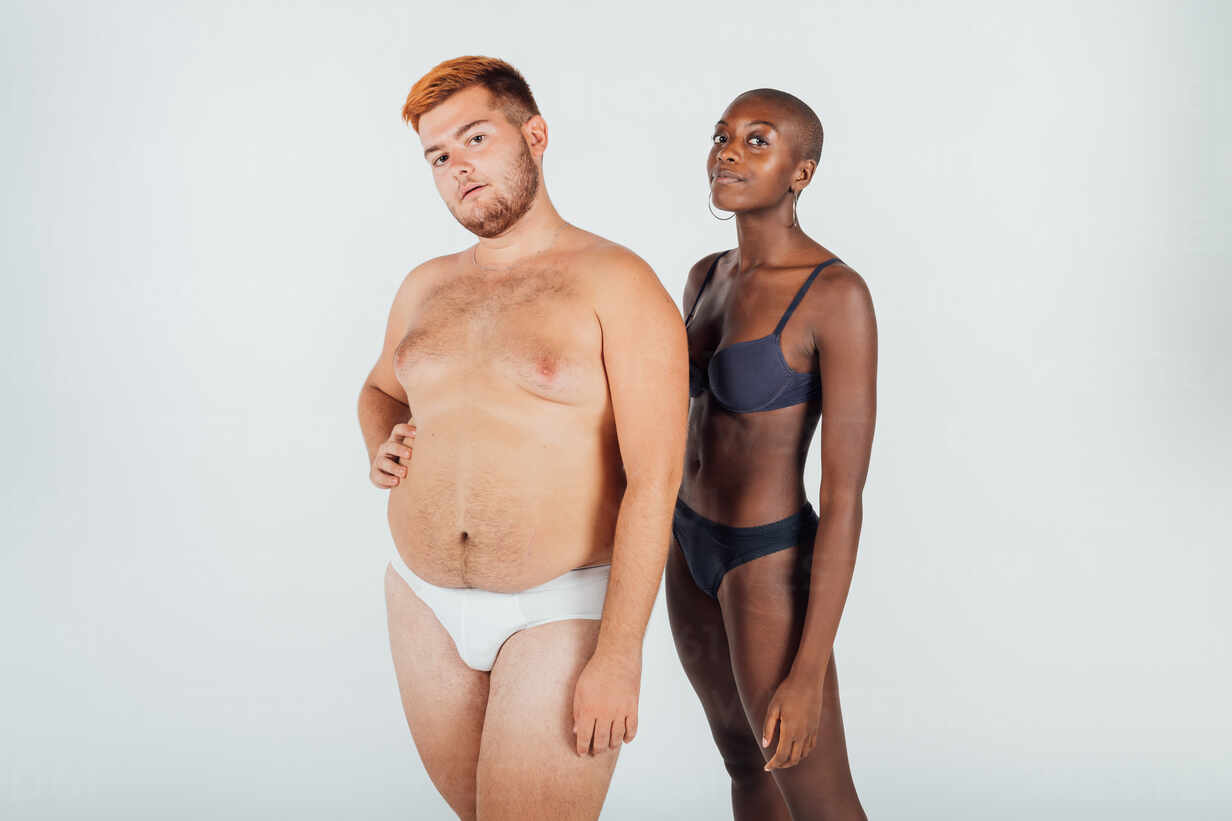 Portrait of a young couple wearing underwear stock photo