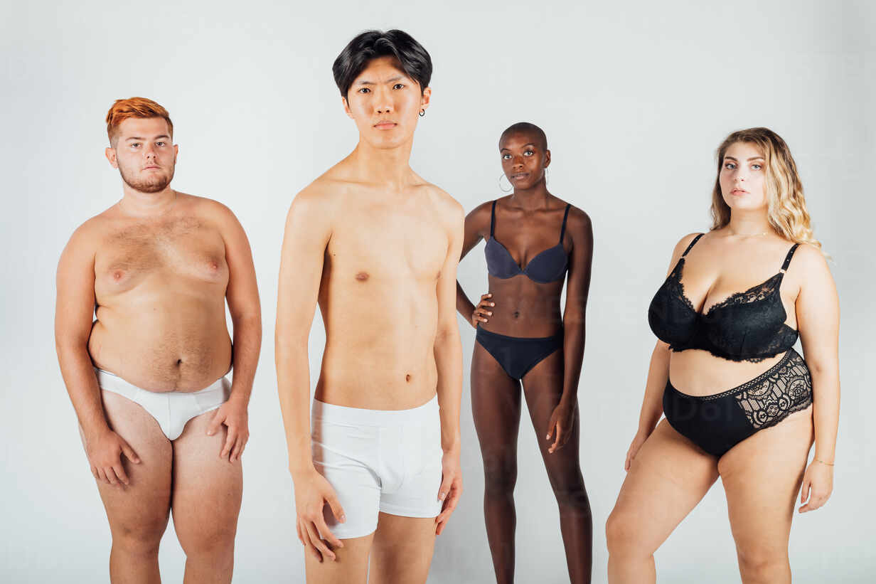 Four young men and women wearing underwear stock photo