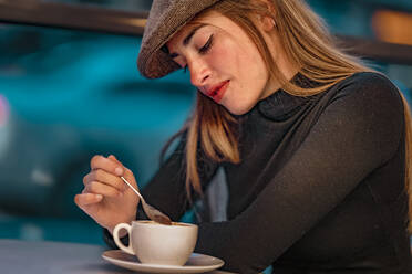 Woman with coffee cup in cafe - GGGF00727