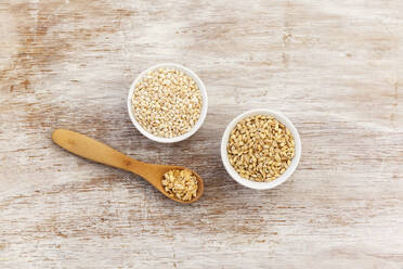 Wooden spoon and two bowls of barley flakes - EVGF03877
