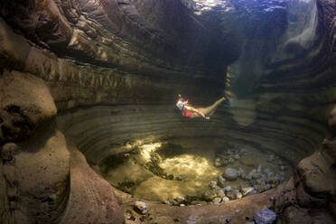 Teenage girl snorkeling in Taugl river, Austria - YRF00254