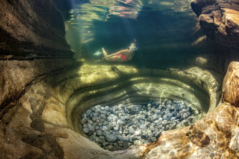 Teenage girl snorkeling in Taugl river, Austria - YRF00255