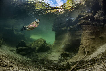 Teenage girl snorkeling in Traun river - YRF00259