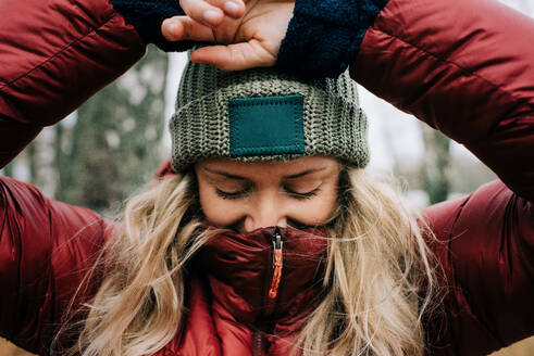 Close up portrait of a woman in the forest the wind blowing her hair - CAVF91562