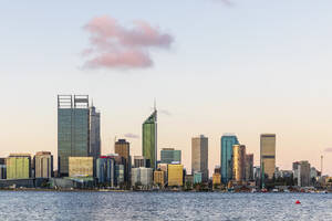 Australia, Perth, Downtown skyscrapers seen across Swan river at sunset - FOF11877