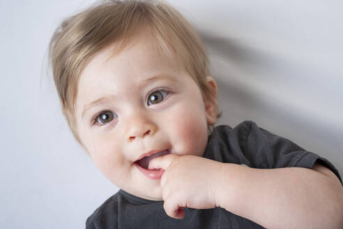 Portrait of baby boy with finger in mouth - ISPF00004