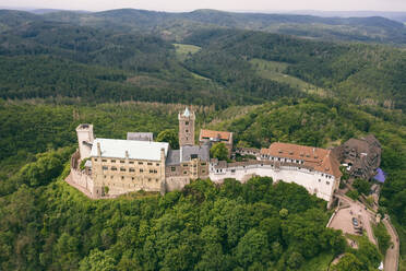 Germany, Thuringia, Eisenach, Aerial view of Wartburg castle - TAMF02729