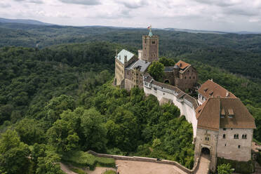 Germany, Thuringia, Eisenach, Aerial view of Wartburg castle - TAMF02730