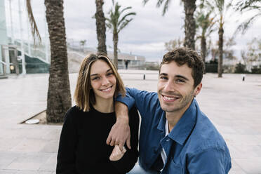 Portrait of smiling couple outdoors - XLGF00991