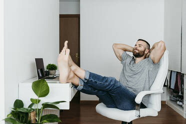 Man taking a break from work at home - EBBF02126