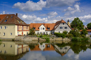 Germany, Bavaria, Wassertrudingen, Wornitzpark watermill reflecting in Wornitz River - LBF03305