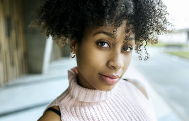 Close-up of beautiful woman with afro hair - MGOF04639