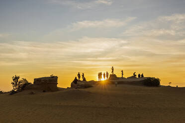 Australia, Oceania, Western Australia, Cervantes, Namburg National Park, People at sunset on Pinnacles Desert  - FOF11898