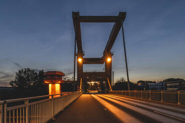 Germany, Hamburg, Reiherstieg bridge illuminated at dusk - KEBF01738