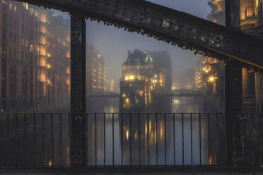 Germany, Hamburg, Speicherstadt, Wasserschloss in fog - KEBF01776