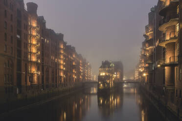 Germany, Hamburg, Speicherstadt, Wasserschloss in fog - KEBF01777